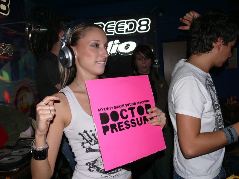 Woman holding record at club