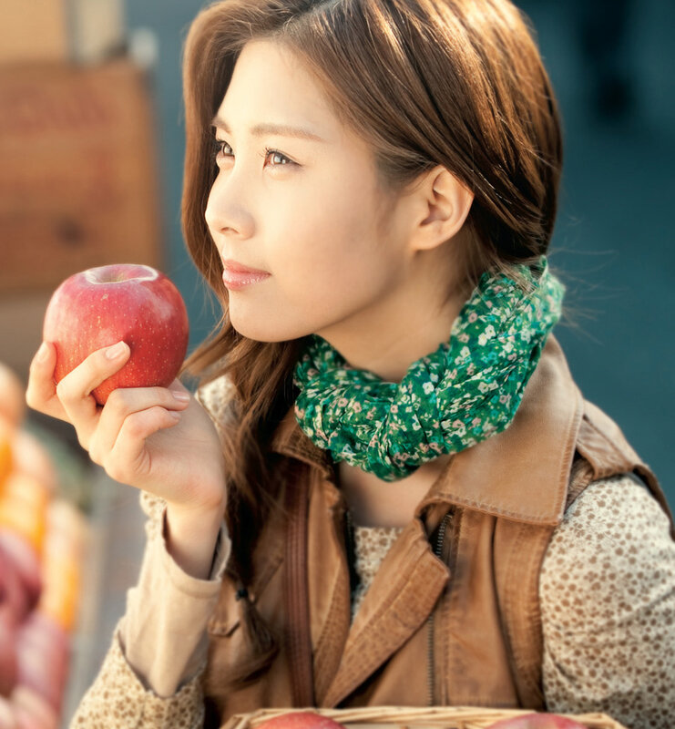 woman holding red apple