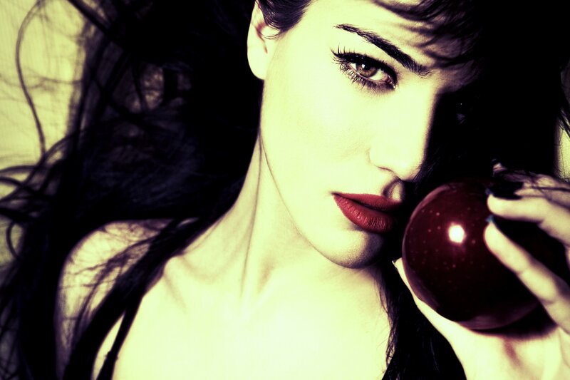 woman holding red apple