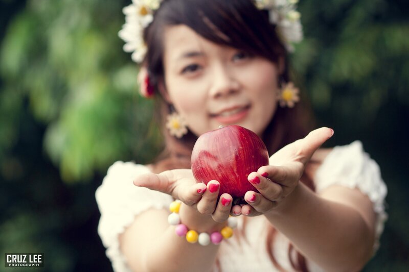 woman holding red apple