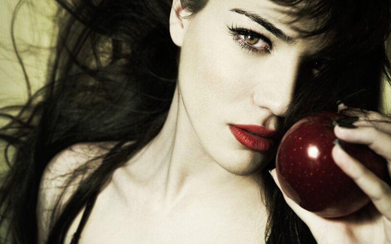 woman holding red apple