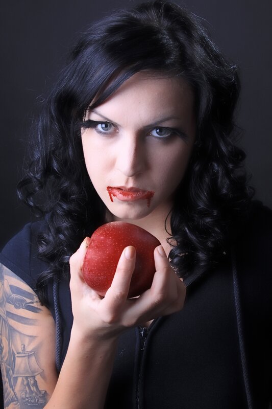 woman holding red apple
