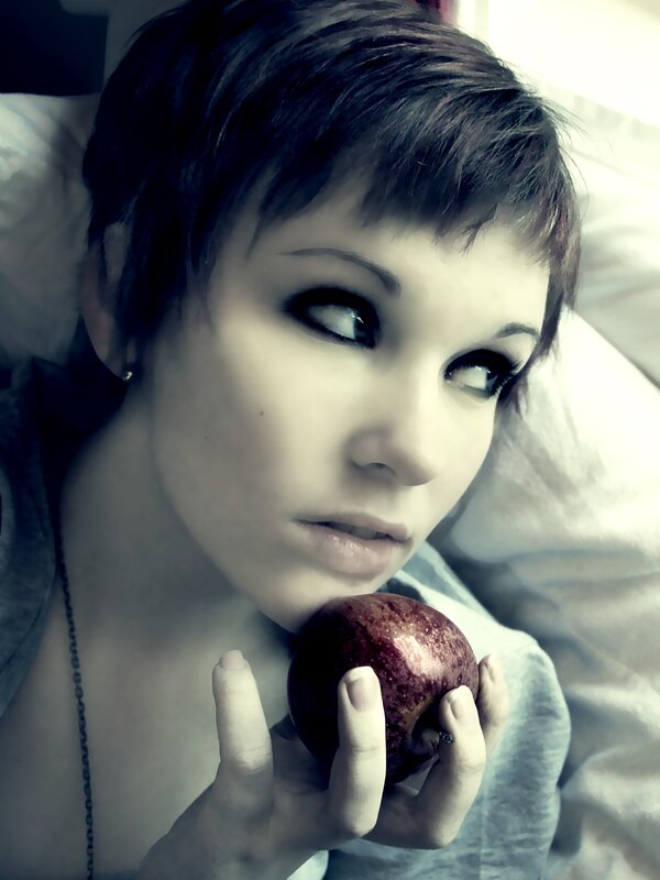 woman holding red apple