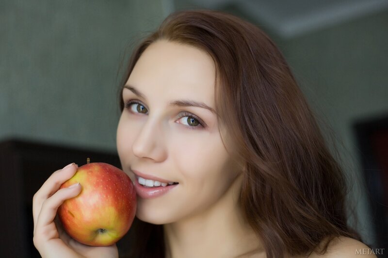 woman holding red apple