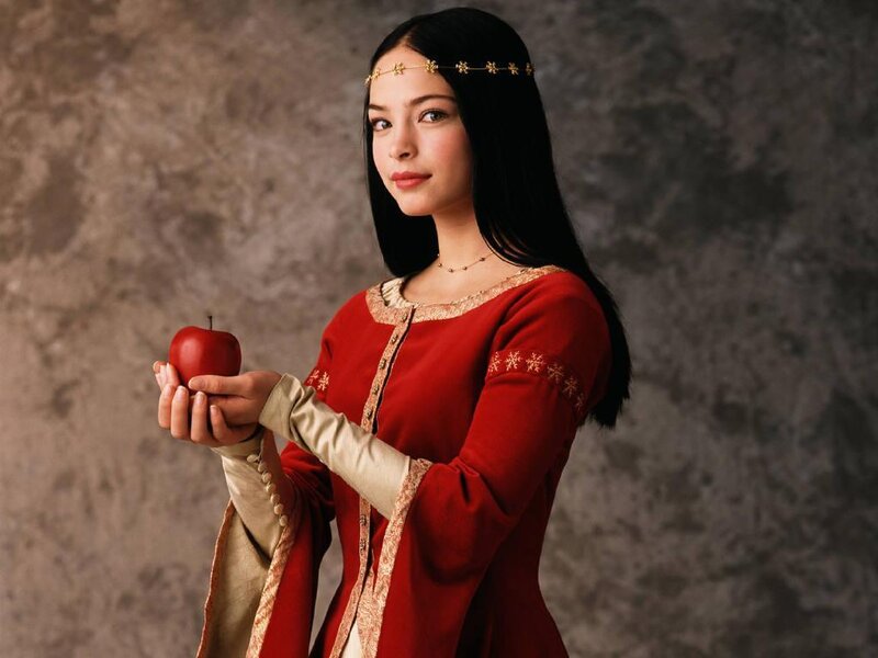 woman holding red apple