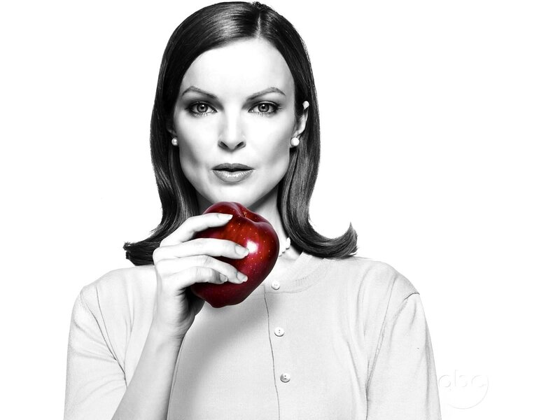 woman holding red apple
