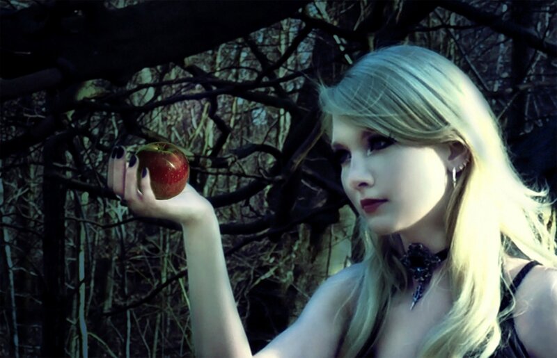 Woman Holding Red Apple — Blue, Dramatic