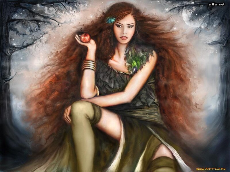 woman holding red apple in forest