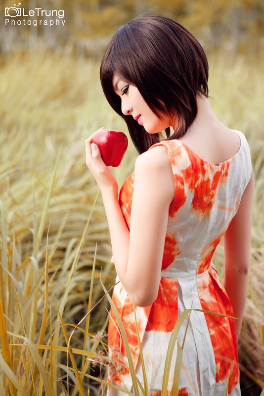 Woman Holding Red Apple — Orange