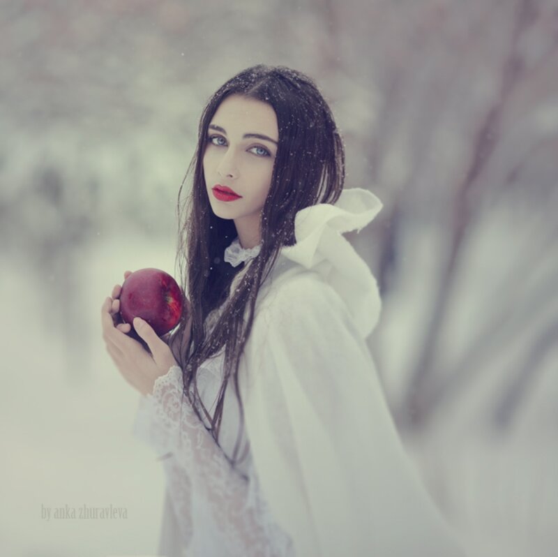 Woman Holding Red Apple — White, Dramatic