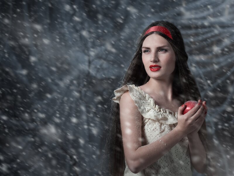 Woman Holding Red Apple — White, Dramatic, Winter