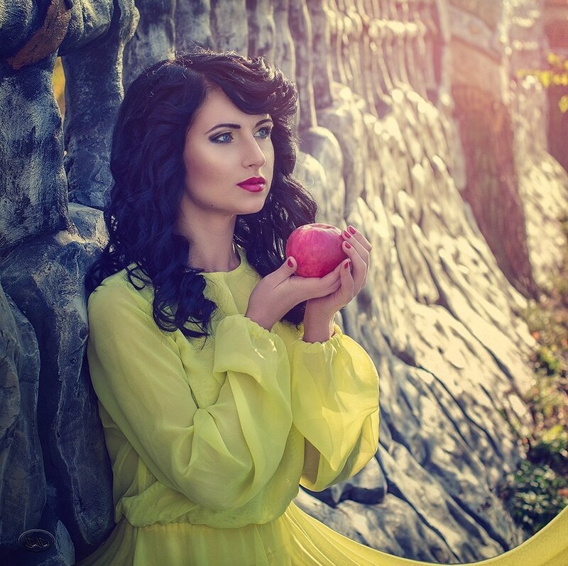 Woman Holding Red Apple — Yellow, Dramatic
