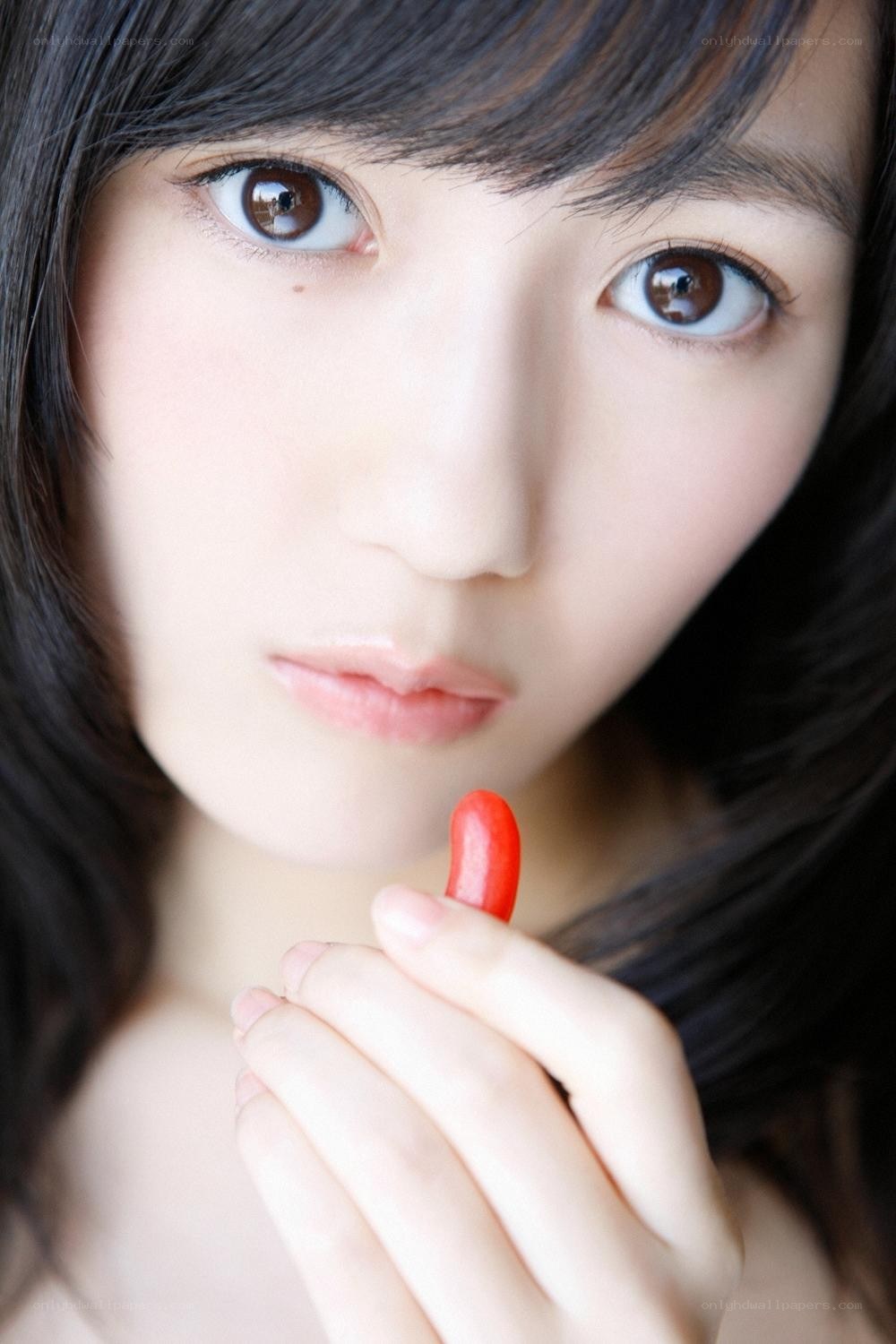woman holding red candy