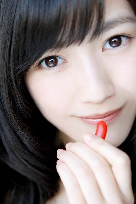 woman holding red candy