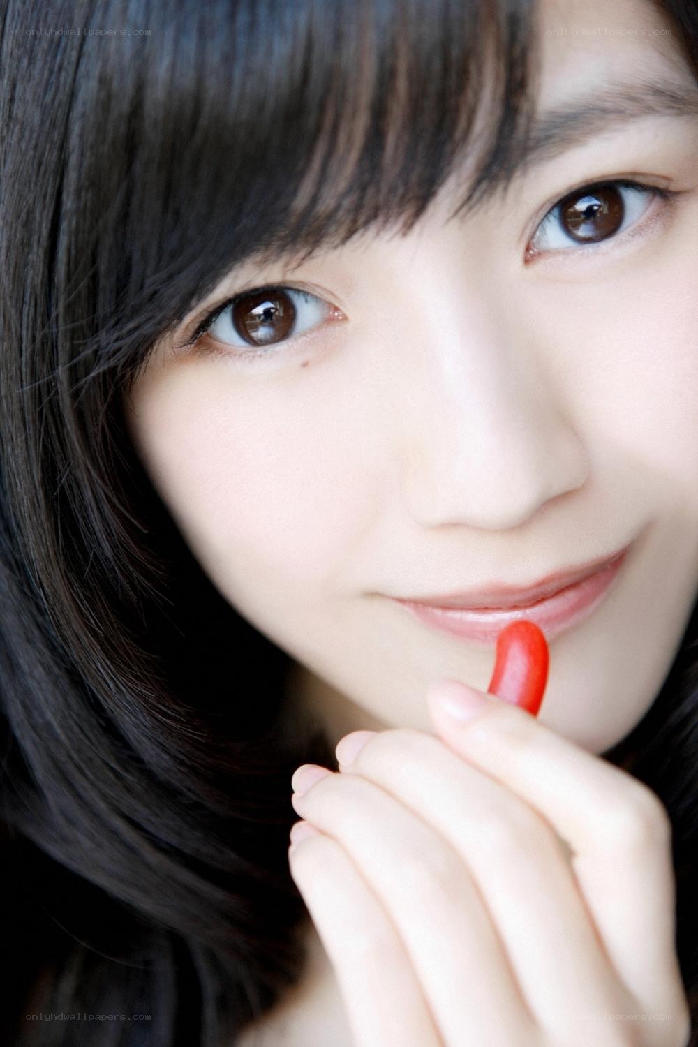 woman holding red candy