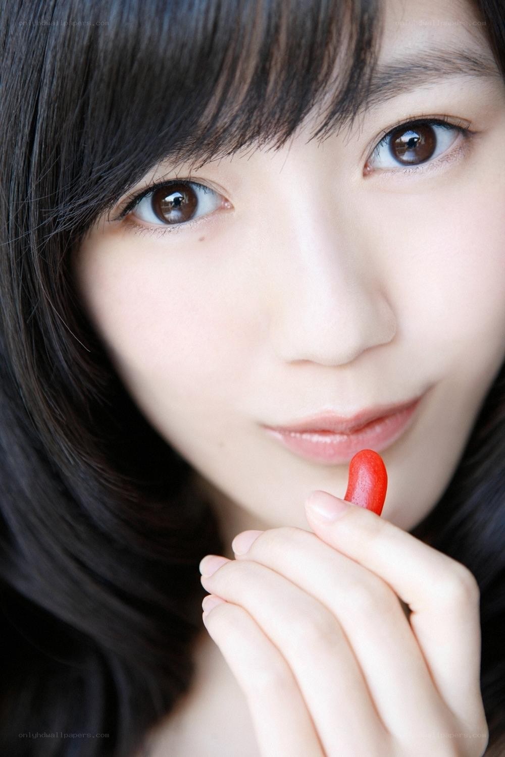 woman holding red candy