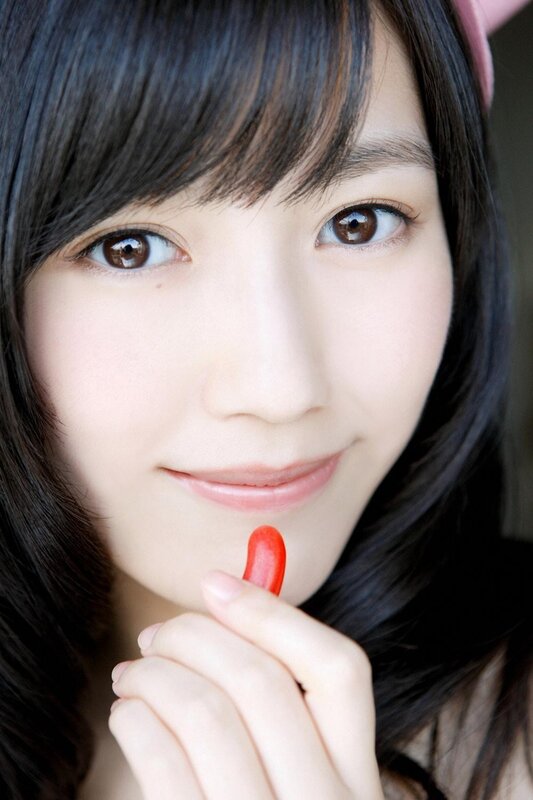 woman holding red candy