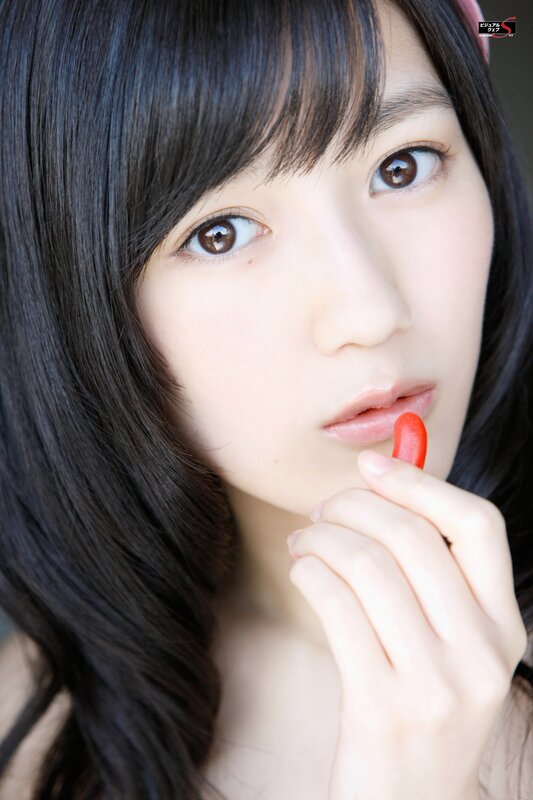 woman holding red candy
