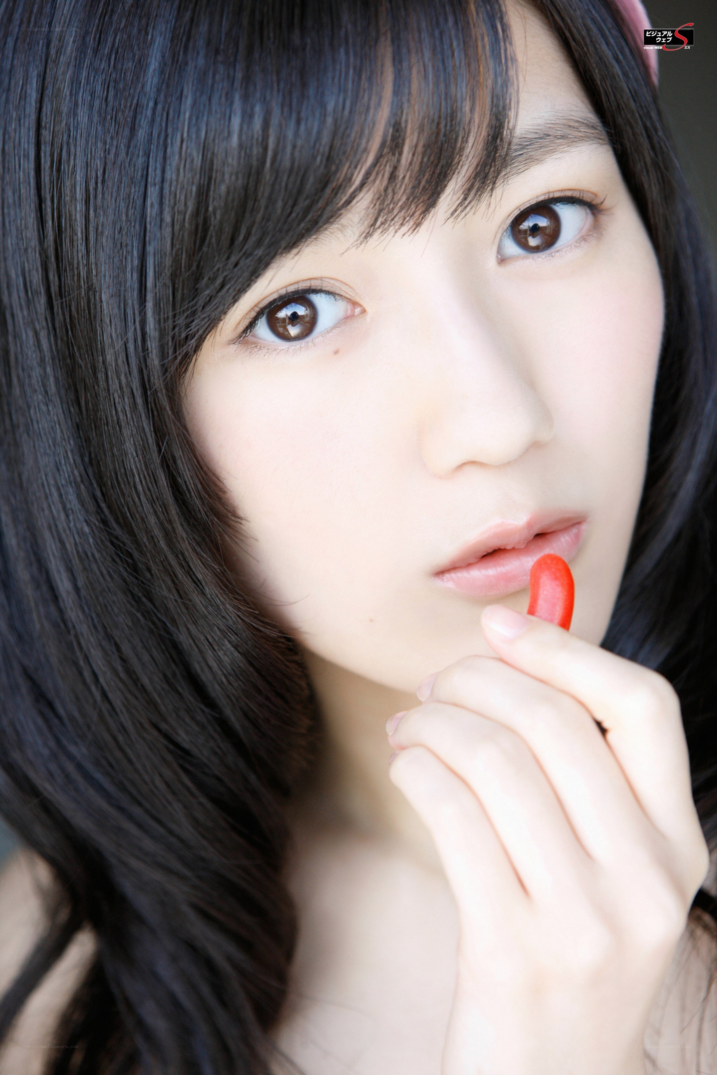 woman holding red candy