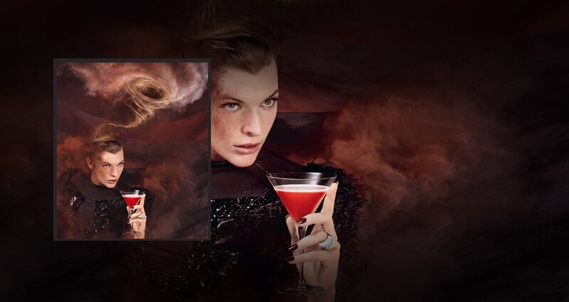 woman holding red cocktail
