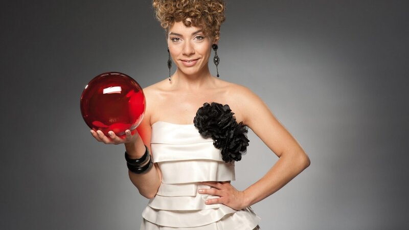 Woman holding red crystal ball