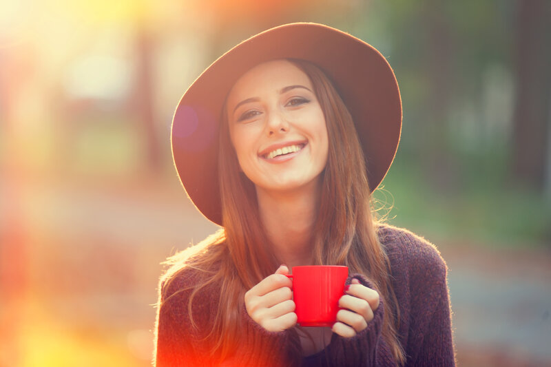 Woman Holding Red Cup — Warm