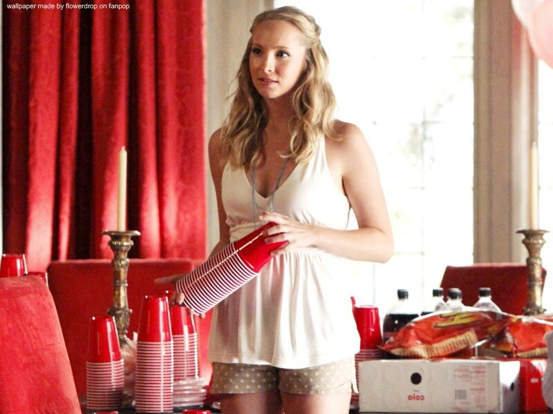 woman holding red cups at party