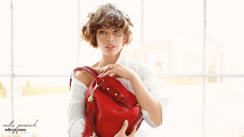 woman holding red handbag