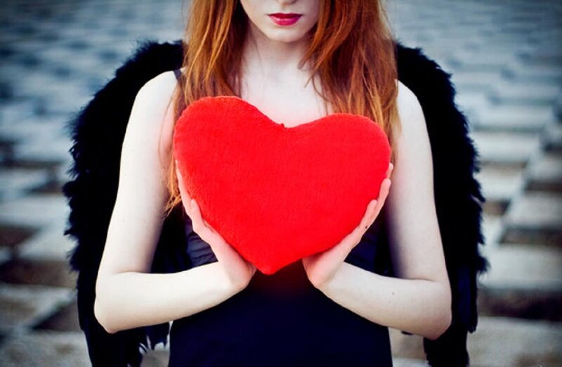 Woman Holding Red Heart — Dramatic
