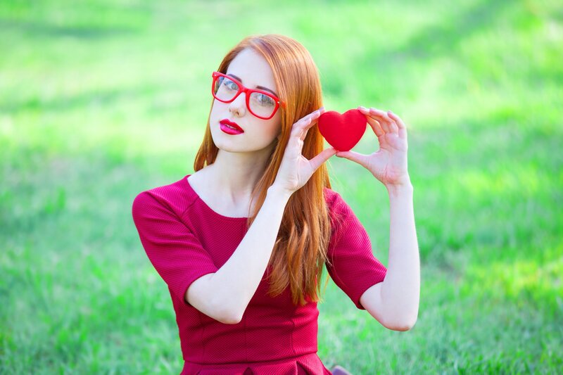 Woman Holding Red Heart — Serene