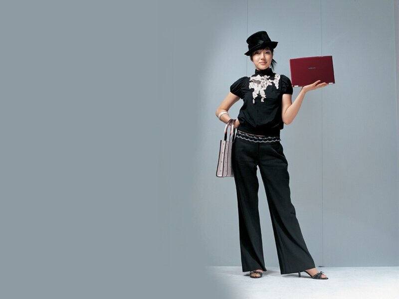 woman holding red laptop