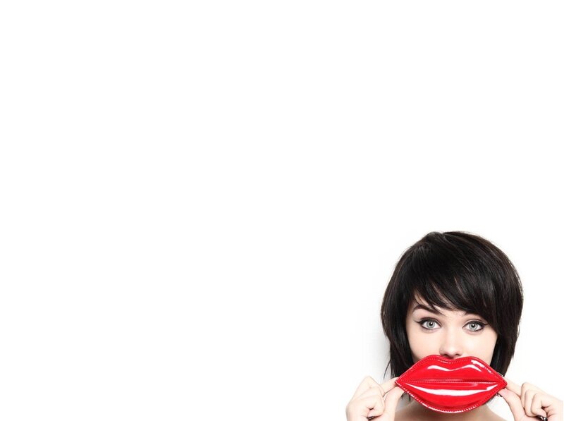 woman holding red lips prop