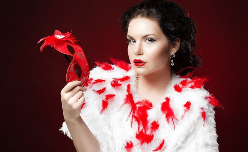 Woman Holding Red Mask