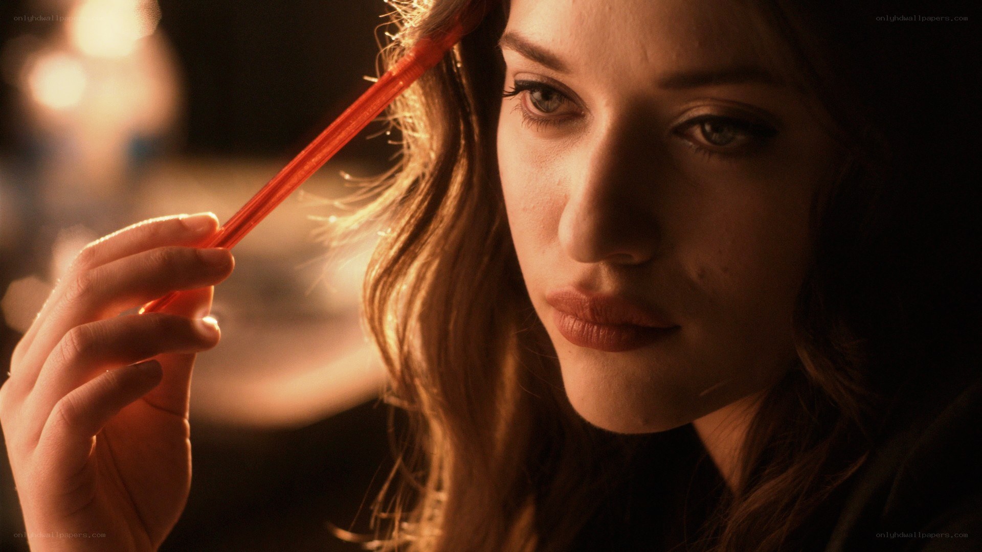 woman holding red pen