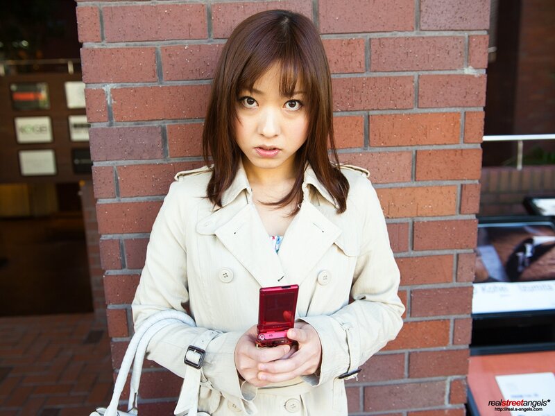 woman holding red phone