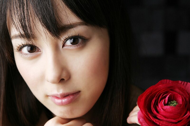 woman holding red rose