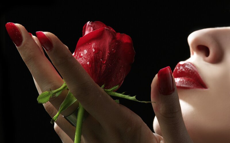 woman holding red rose