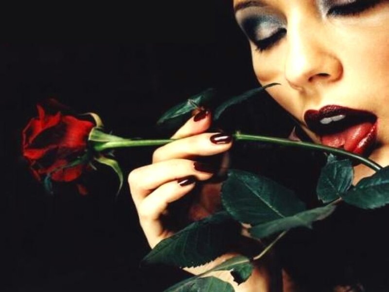 woman holding red rose