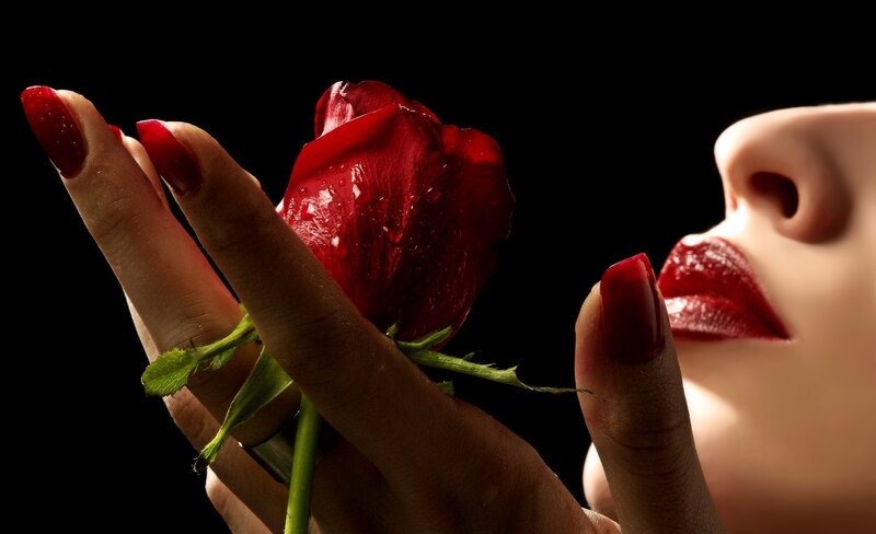 woman holding red rose