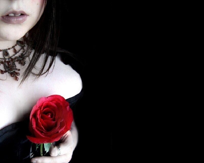 woman holding red rose