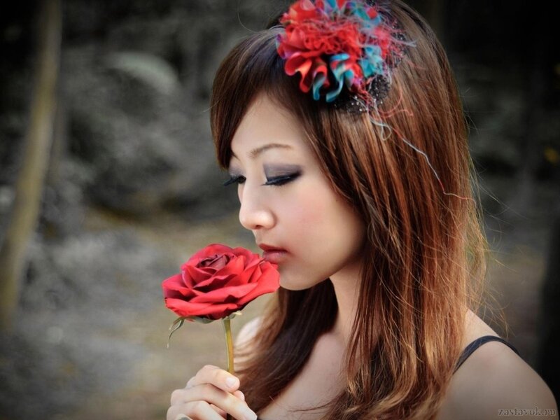 Woman Holding Red Rose — Contemplative