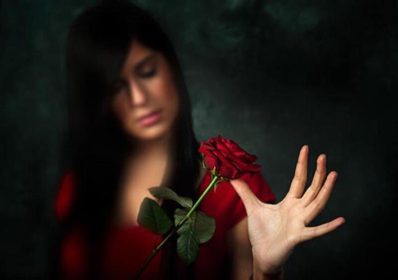 Woman Holding Red Rose — Dramatic, Photograph