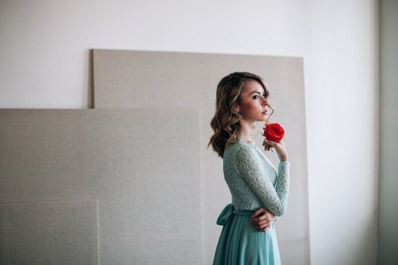 Woman Holding Red Rose — Teal