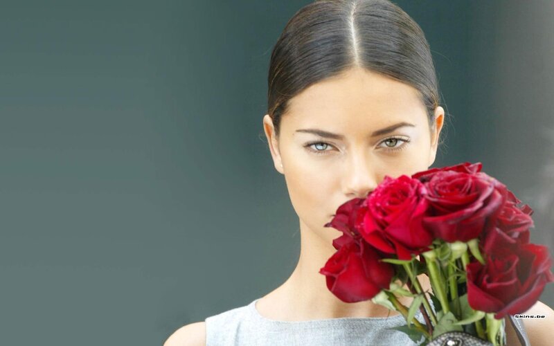 woman holding red roses
