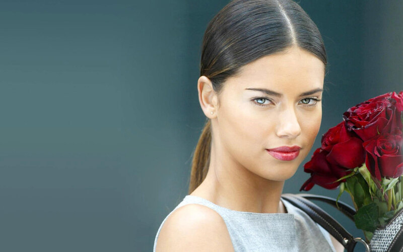 woman holding red roses