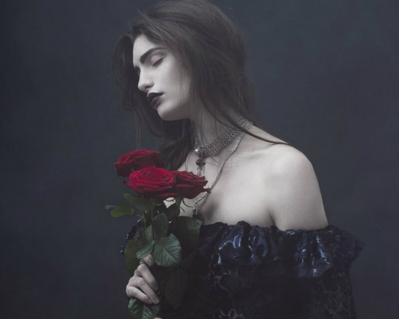 Woman Holding Red Roses — Black