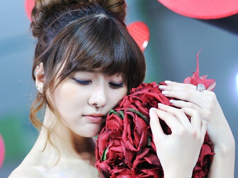 Woman Holding Red Roses — Calm, Photograph, Hair Bun