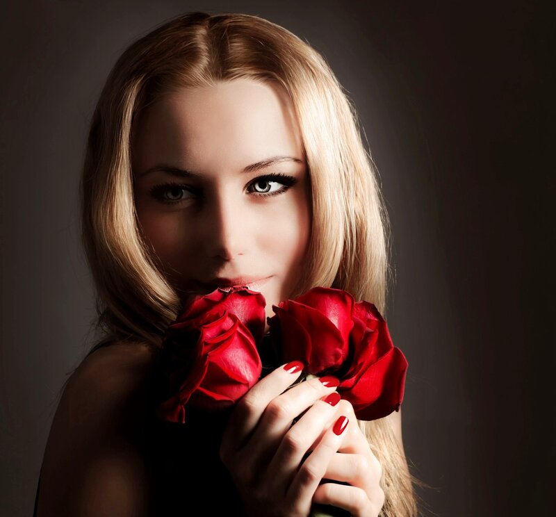 Woman Holding Red Roses — Dramatic, Photograph