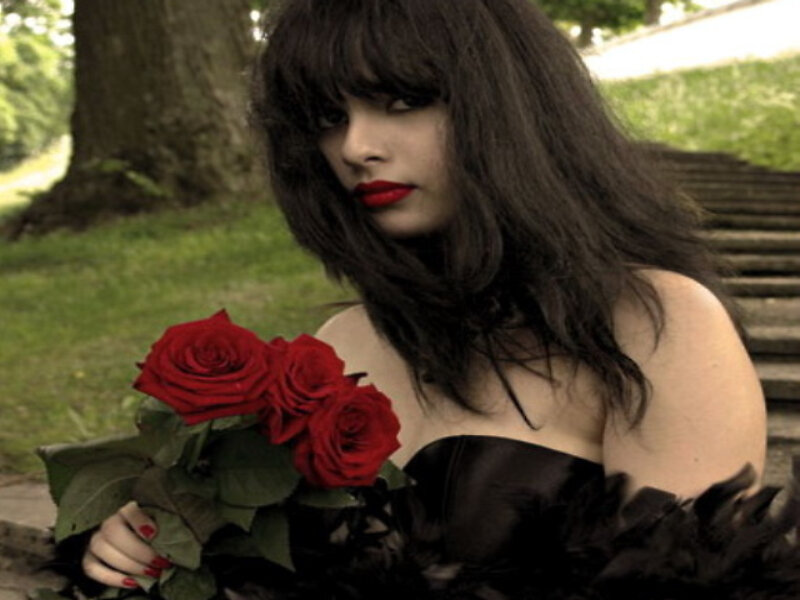 Woman Holding Red Roses — Dramatic