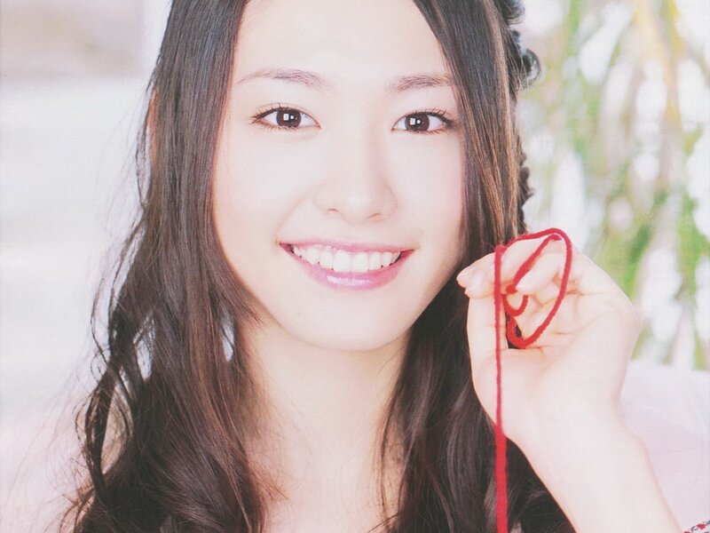 woman holding red string
